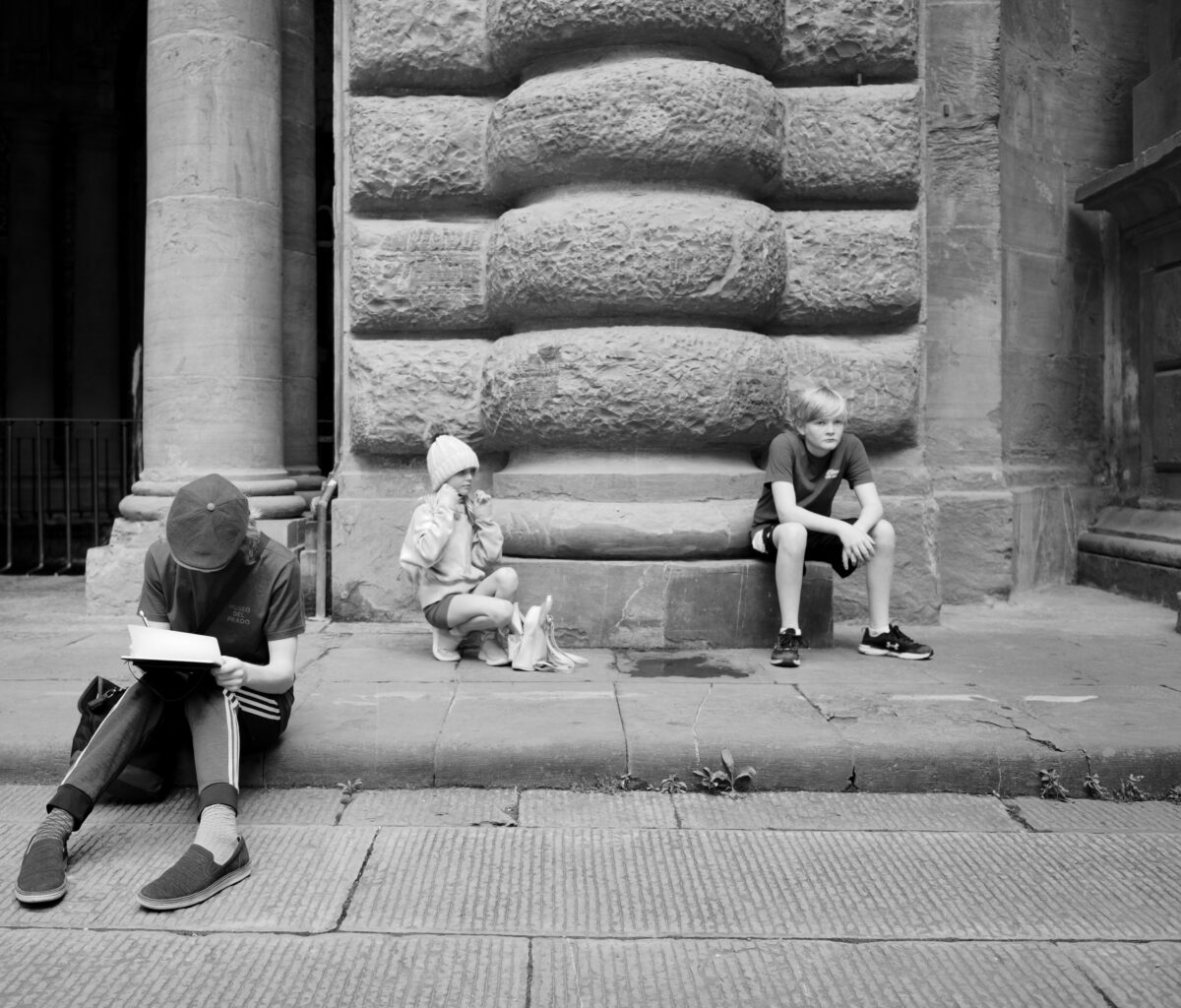 My children waiting with varying levels of patience for me to finish touring the Bargello in Florence.